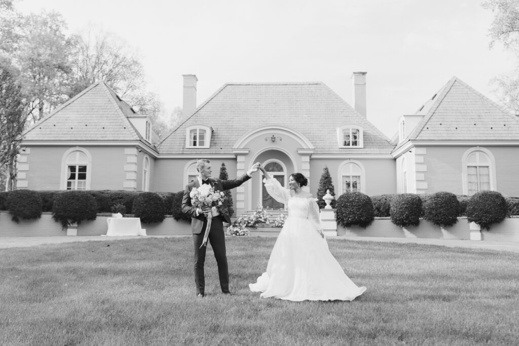 Couple poses in front of Broyhill Chateau