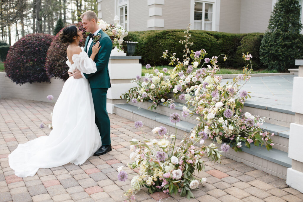 wedding photographer captures couple during wedding ceremony at broyhill chateau near blowing rock north carolina