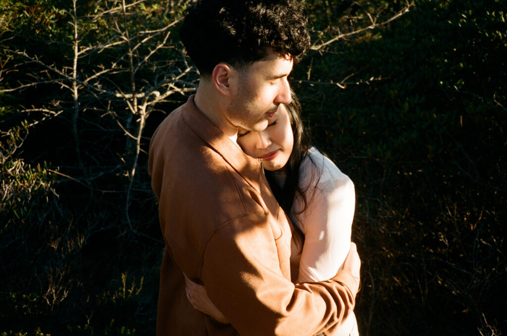 couple on hawksbill mountain during their engagement session