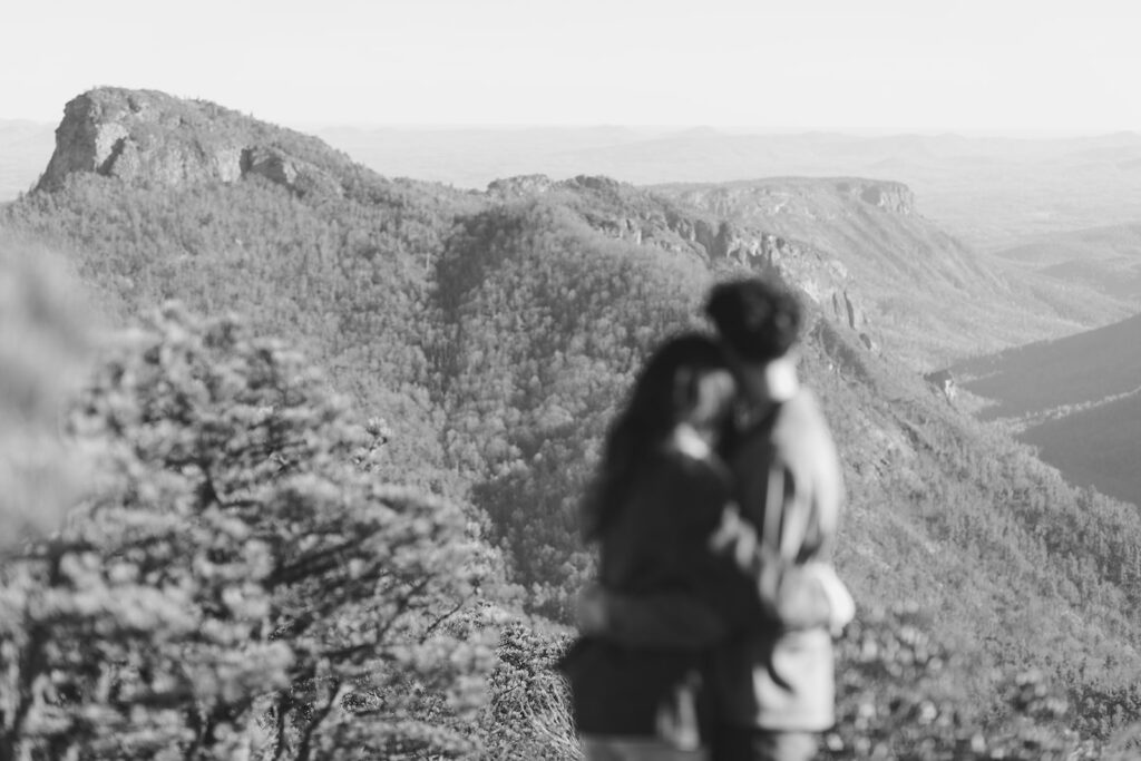 asheville engagement photographer captures couple on a mountaintop in linville gorge