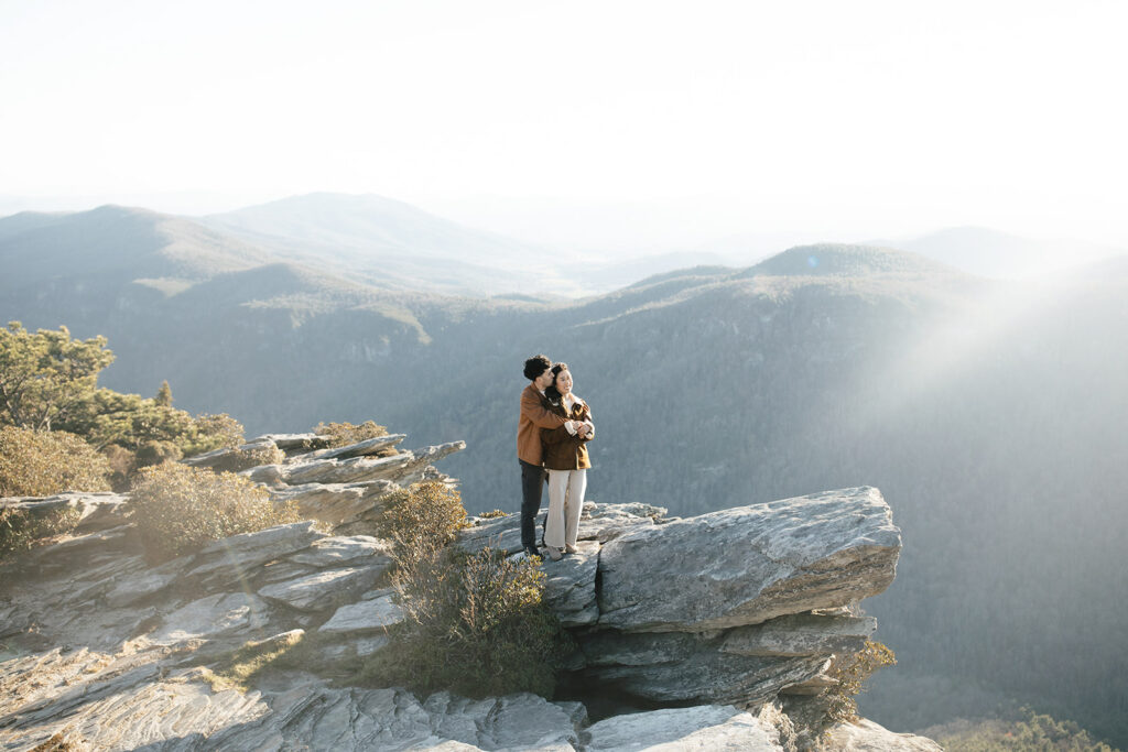 couple on hawksbill mountain for their engagement session