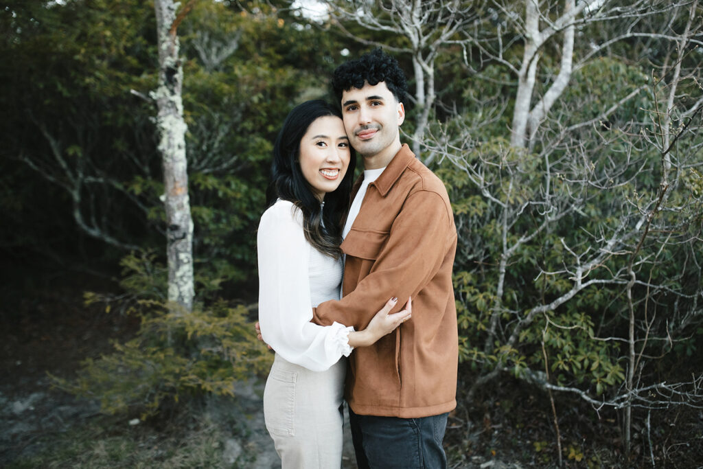 asheville engagement photographer captures couple on a mountaintop in linville gorge