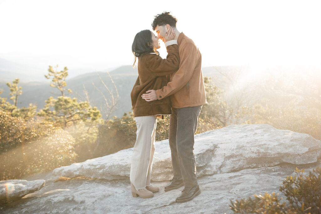 asheville engagement photographer captures couple on a mountaintop in linville gorge