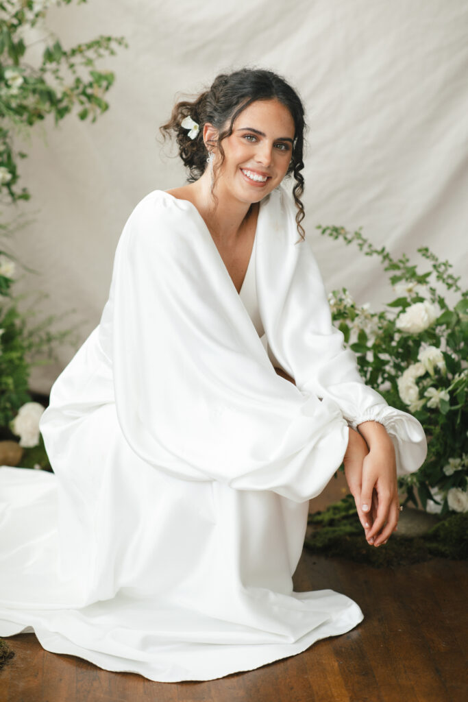 bride posting smiling at the mill studio photographed by asheville wedding photographer